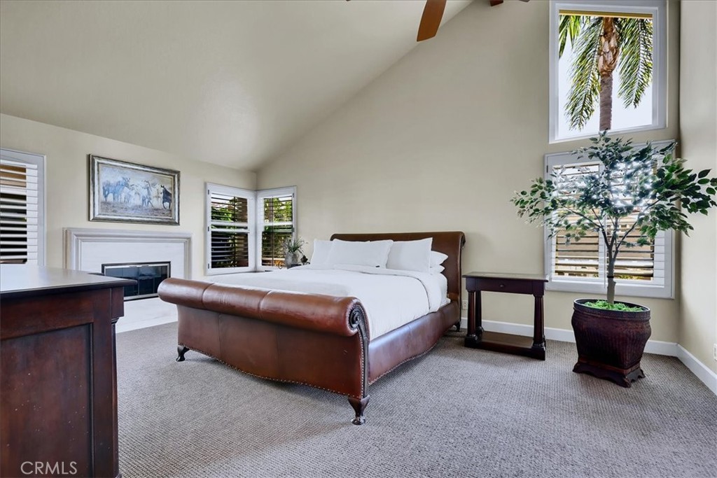 22 Colonial Irvine, CA 92620 - Photo 32 of 47 a bedroom with a bed and a potted plant