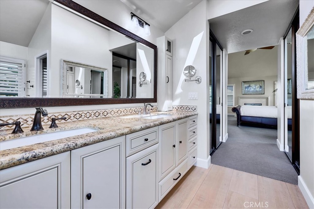 22 Colonial Irvine, CA 92620 - Photo 36 of 47 a en suite bathroom with double sink and a large mirror