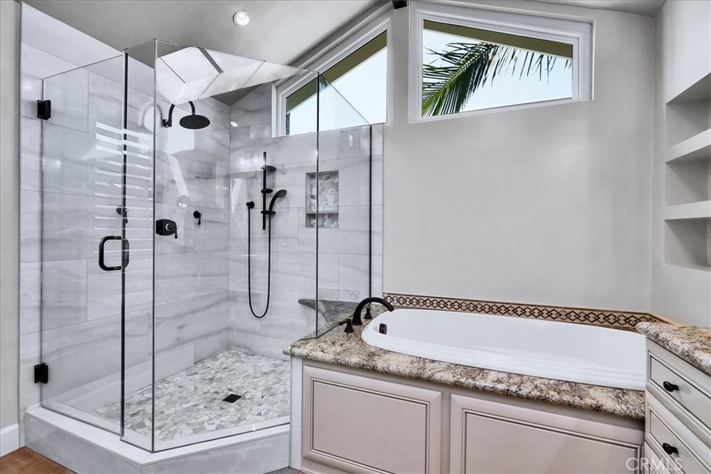 22 Colonial Irvine, CA 92620 - Photo 37 of 47 a bath tub sitting next to a shower