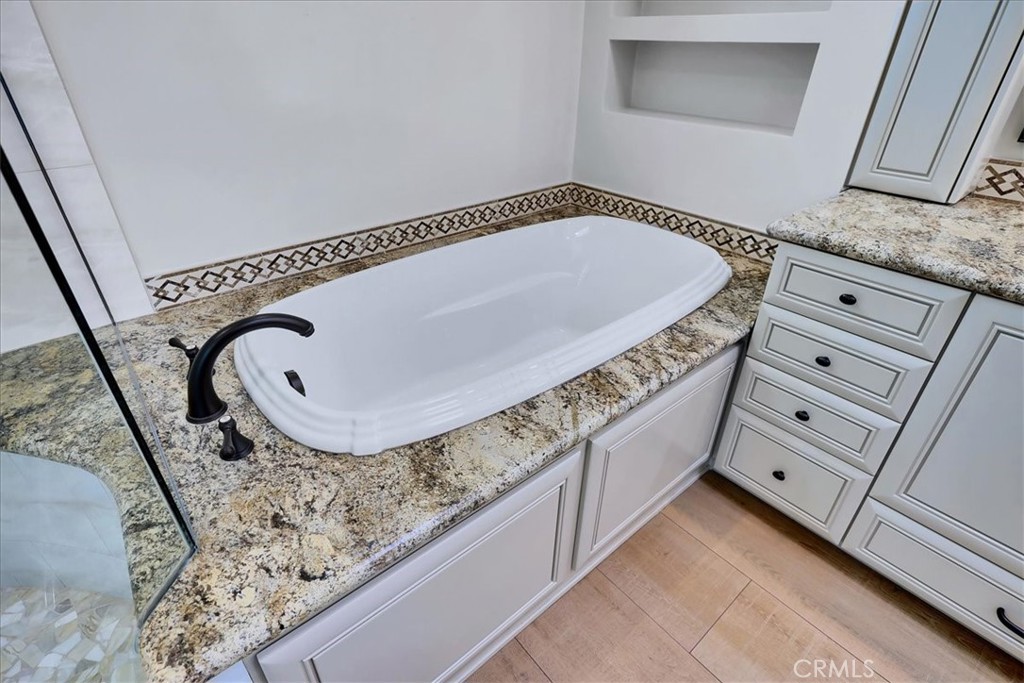 22 Colonial Irvine, CA 92620 - Photo 39 of 47 a bathroom with a tub and sink
