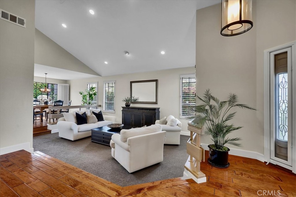 22 Colonial Irvine, CA 92620 - Photo 4 of 47 a living room with furniture floor to ceiling window and potted plant