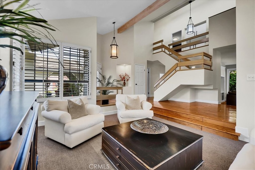 22 Colonial Irvine, CA 92620 - Photo 5 of 47 a living room with furniture and a table