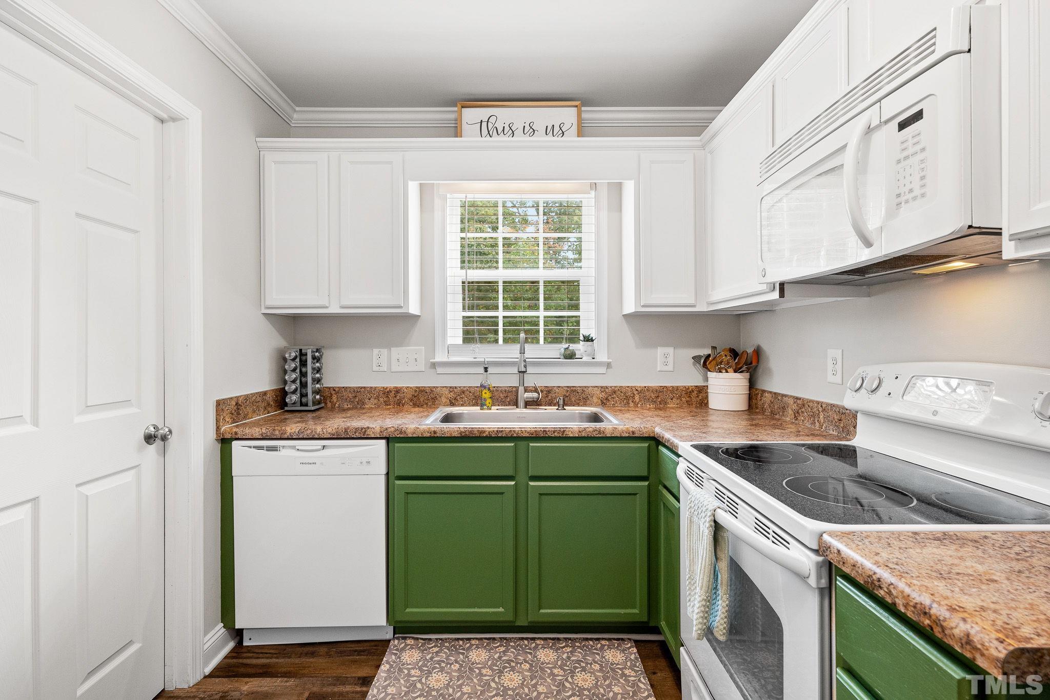 7405 Buckingham Mountain Road Snow Camp, NC 27349 - Photo 10 of 26 a kitchen with a sink stove and cabinets