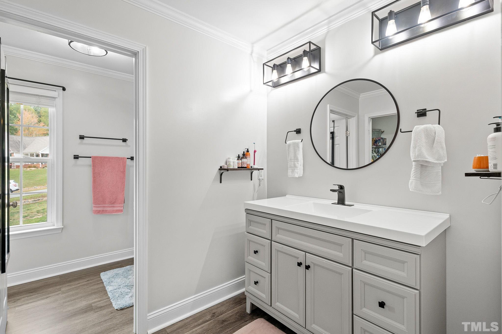 7405 Buckingham Mountain Road Snow Camp, NC 27349 - Photo 14 of 26 a bathroom with a sink and a mirror