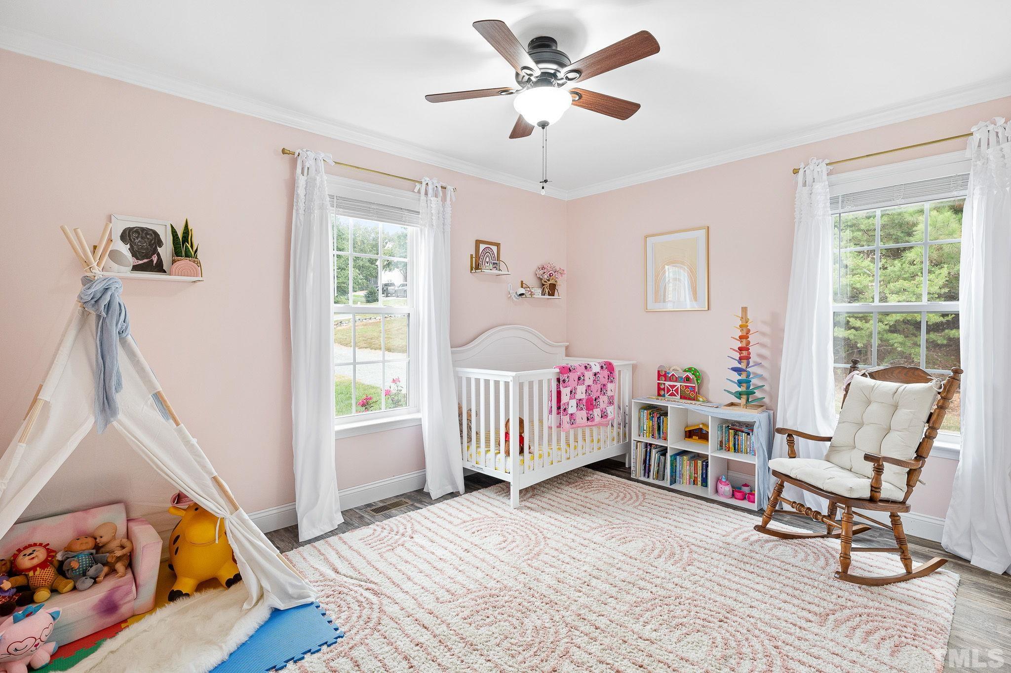 7405 Buckingham Mountain Road Snow Camp, NC 27349 - Photo 17 of 26 a bedroom with furniture and a window