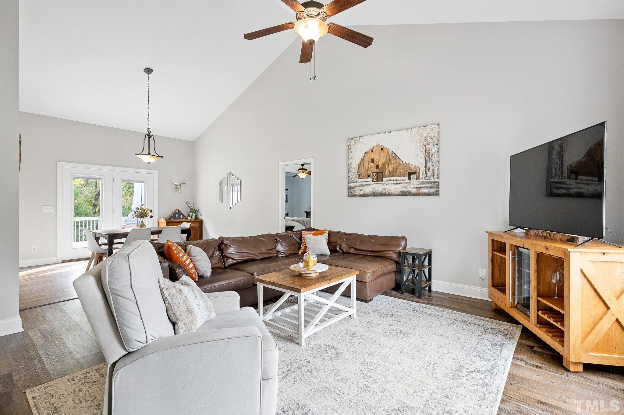 7405 Buckingham Mountain Road Snow Camp, NC 27349 - Photo 2 of 26 a living room with furniture and a flat screen tv