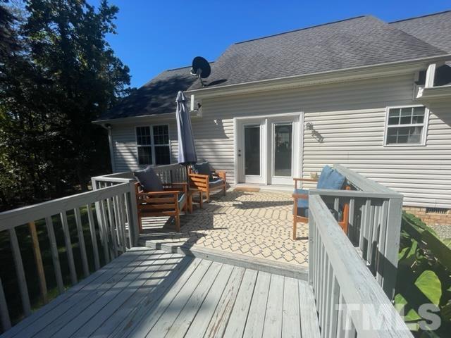 7405 Buckingham Mountain Road Snow Camp, NC 27349 - Photo 21 of 26 a view of a house with wooden deck