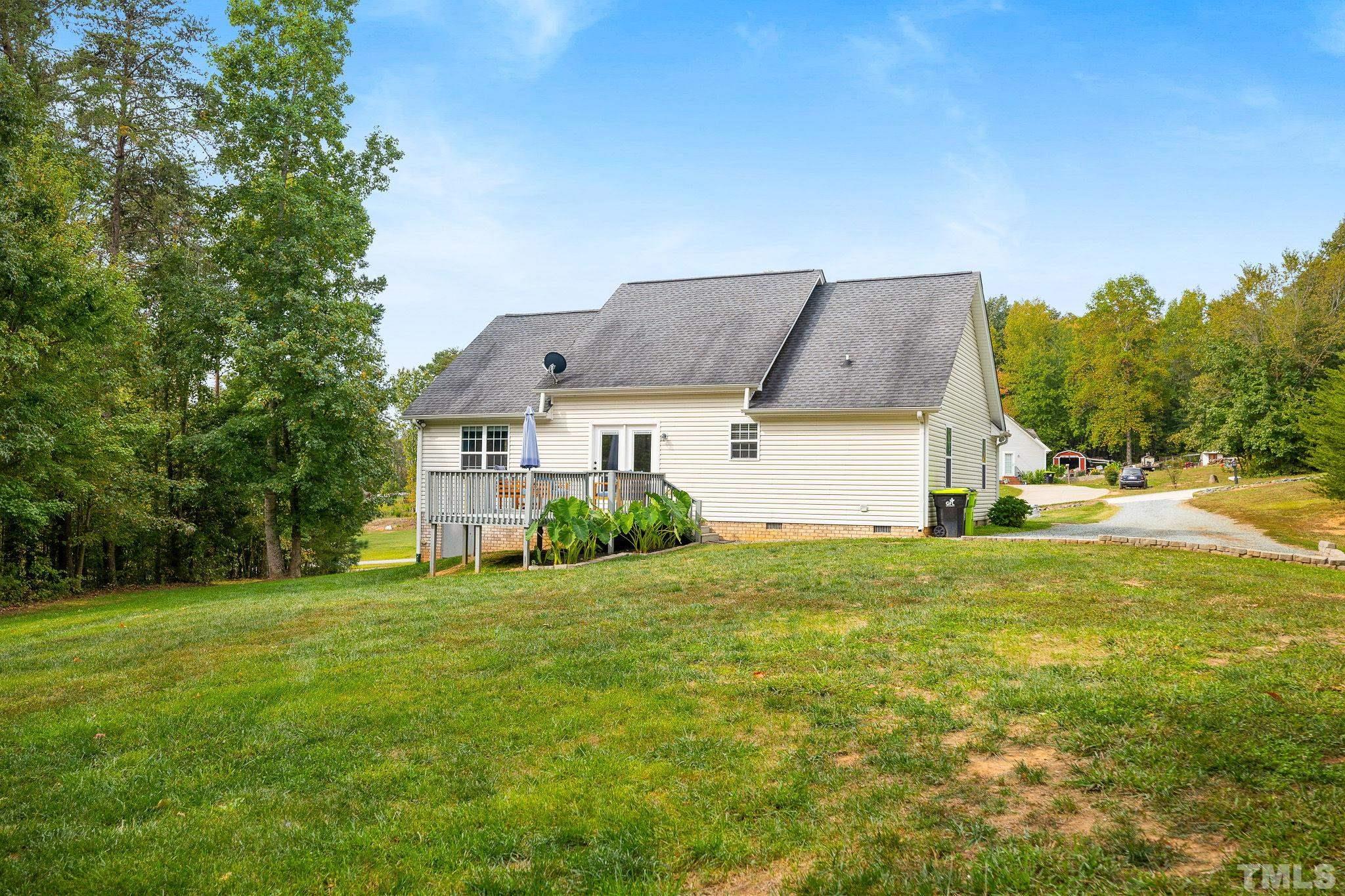 7405 Buckingham Mountain Road Snow Camp, NC 27349 - Photo 24 of 26 front view of house with a yard