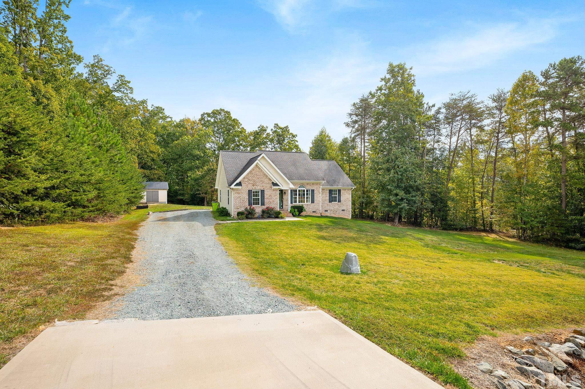 7405 Buckingham Mountain Road Snow Camp, NC 27349 - Photo 25 of 26 a view of a swimming pool with lounge chair