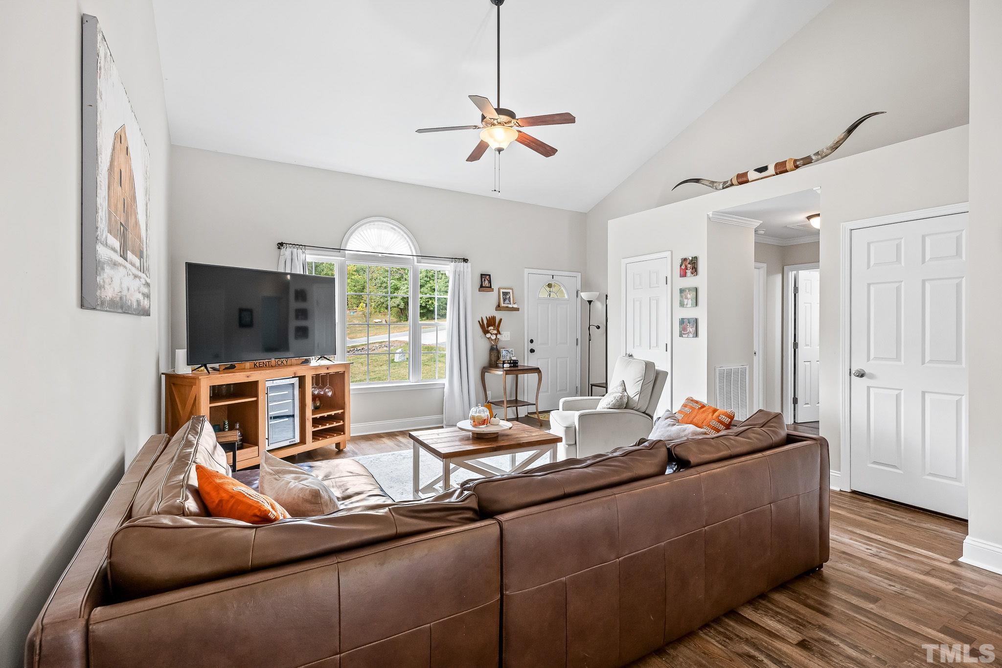 7405 Buckingham Mountain Road Snow Camp, NC 27349 - Photo 3 of 26 a living room with furniture and a flat screen tv