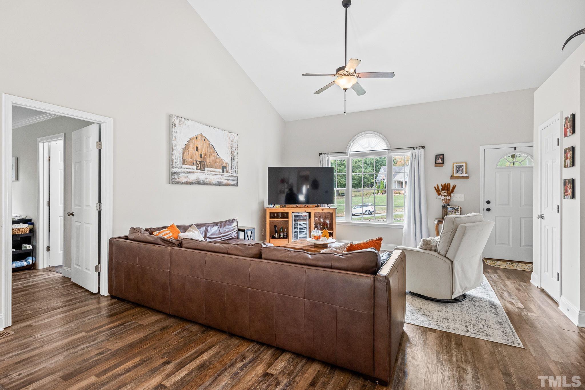 7405 Buckingham Mountain Road Snow Camp, NC 27349 - Photo 4 of 26 a living room with furniture and a flat screen tv