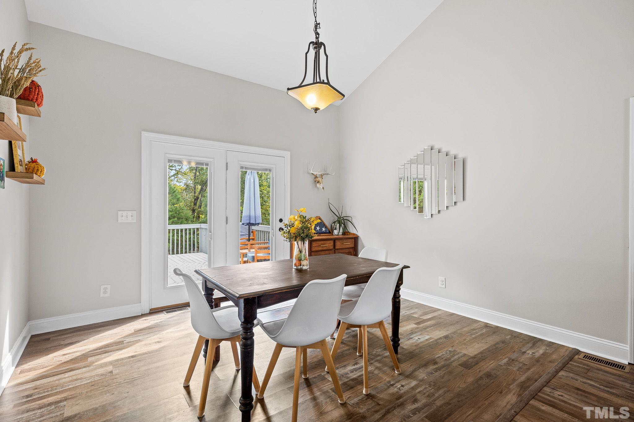 7405 Buckingham Mountain Road Snow Camp, NC 27349 - Photo 5 of 26 a dining room with furniture and window
