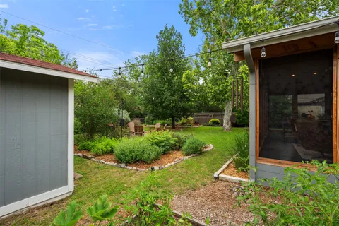 a view of a back yard of the house
