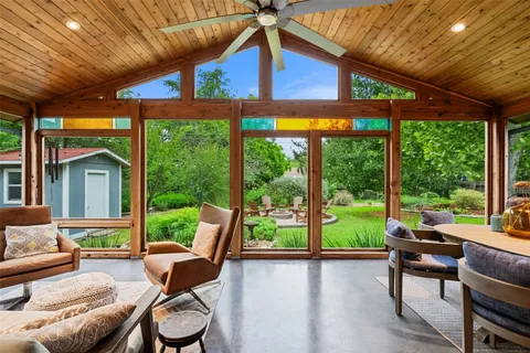 a patio with yard table and chairs