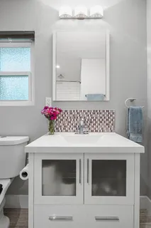 a bathroom with a sink and a mirror