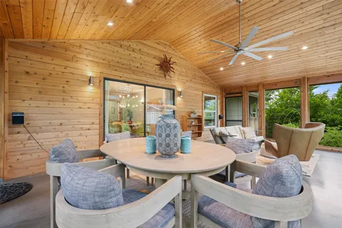 a dining room with furniture wooden floor and a potted plant