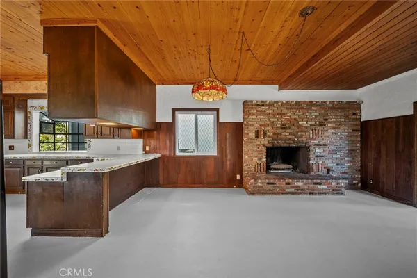 a view of a kitchen with a sink and cabinets