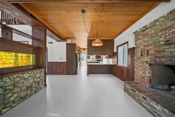 a large kitchen with stainless steel appliances granite countertop a sink and cabinets