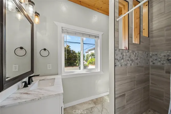 a bathroom with a bathtub and a shower