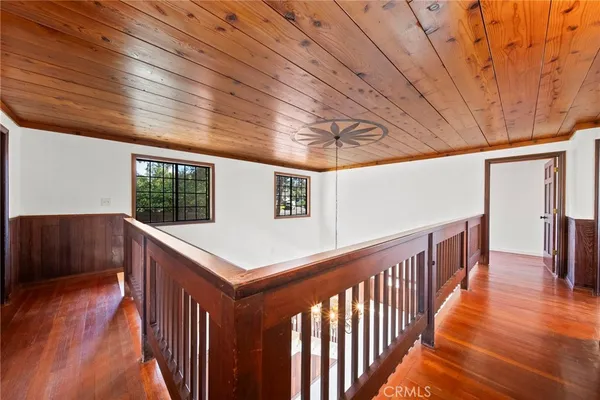 a view of a balcony with wooden floor