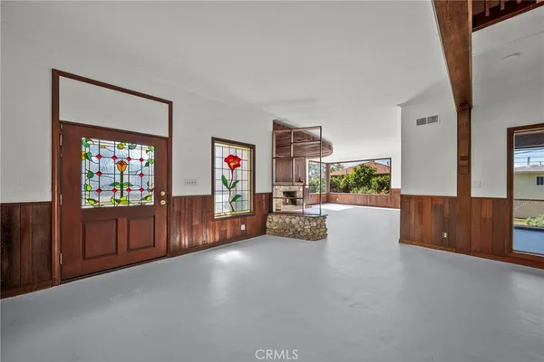 a view of a livingroom with furniture and a flat screen tv