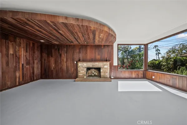 a view of an empty room with a fireplace