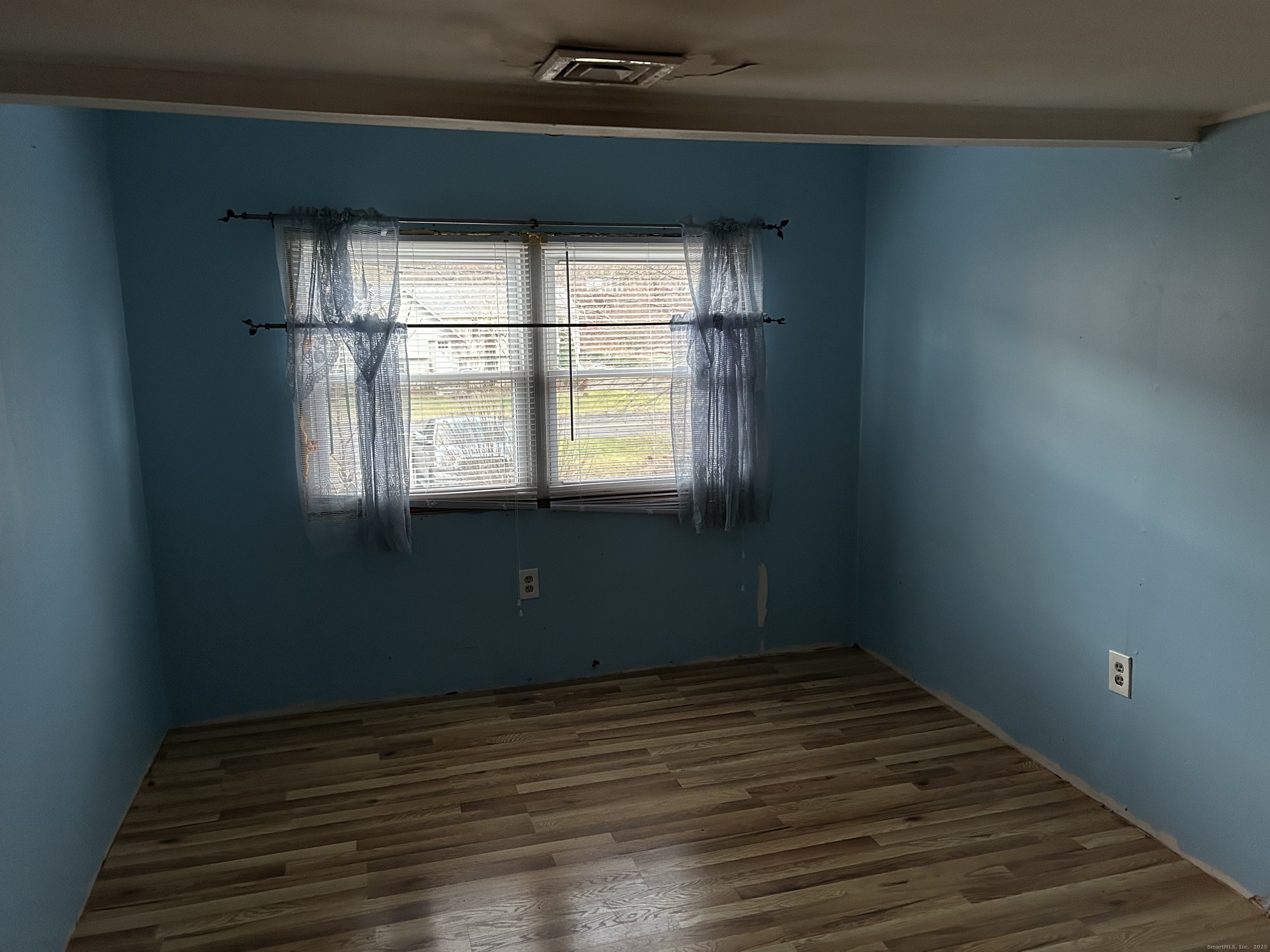 236 Union City Road Naugatuck, CT 06770 - Photo 17 of 28 a view of empty room with wooden floor and fan