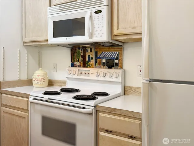 a kitchen with a stove and a microwave