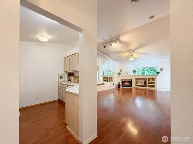 a view of kitchen with furniture and wooden floor