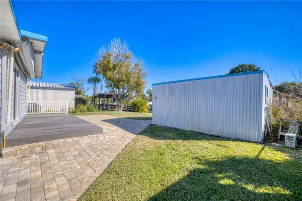 a view of yard with patio