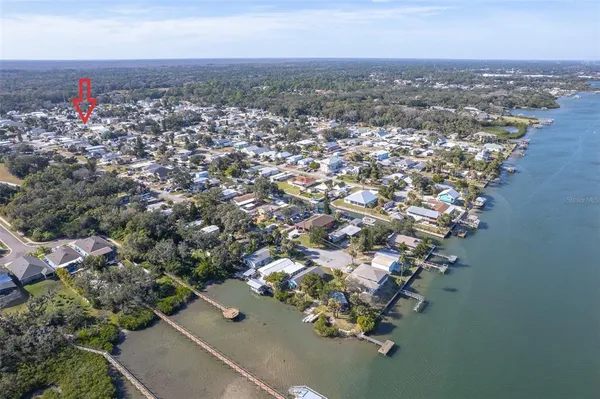 an aerial view of a city with ocean view