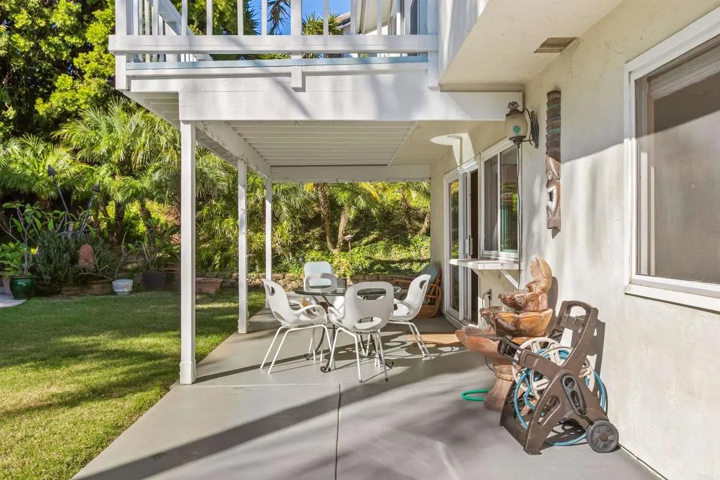 2252 Soledad Rancho Road San Diego, CA 92109 - Photo 11 of 39 a view of a patio with table and chairs and potted plants