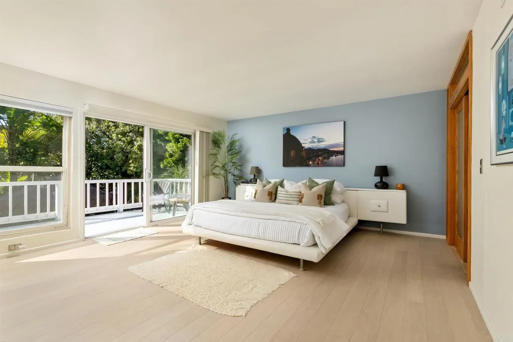 2252 Soledad Rancho Road San Diego, CA 92109 - Photo 15 of 39 a bed room with a bed and a large window