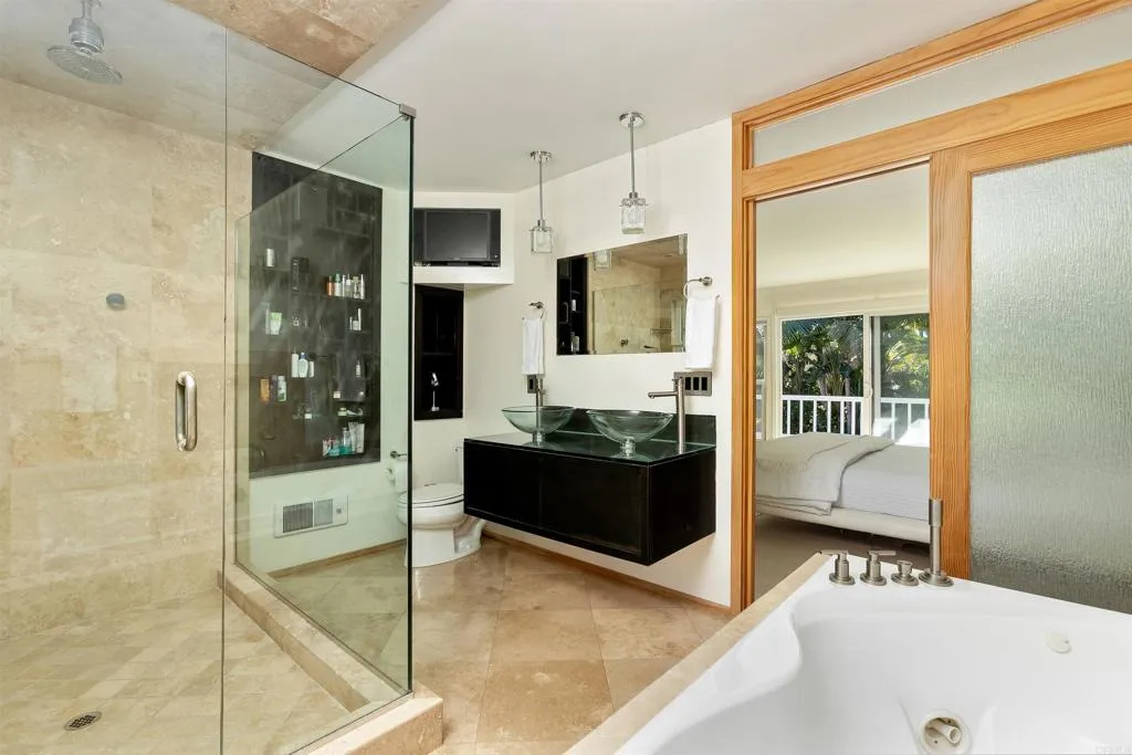 2252 Soledad Rancho Road San Diego, CA 92109 - Photo 18 of 39 a kitchen with stainless steel appliances kitchen island granite countertop a refrigerator and a cabinets