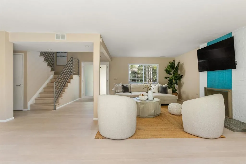 2252 Soledad Rancho Road San Diego, CA 92109 - Photo 2 of 39 a living room with couches and a flat screen tv