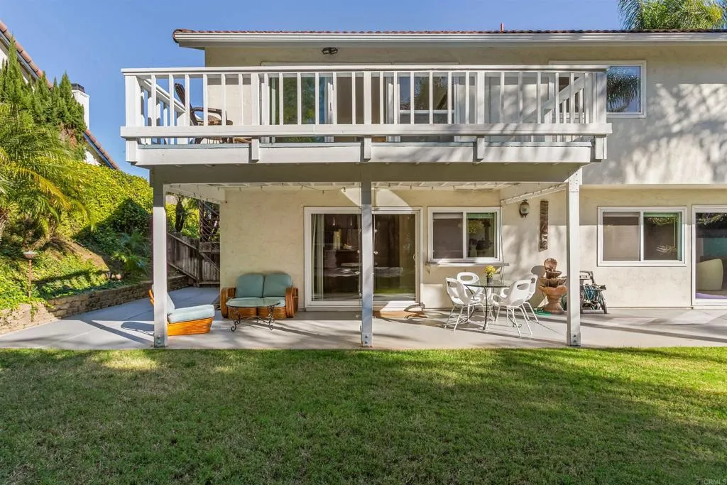 2252 Soledad Rancho Road San Diego, CA 92109 - Photo 31 of 39 a view of a patio with table and chairs and potted plants