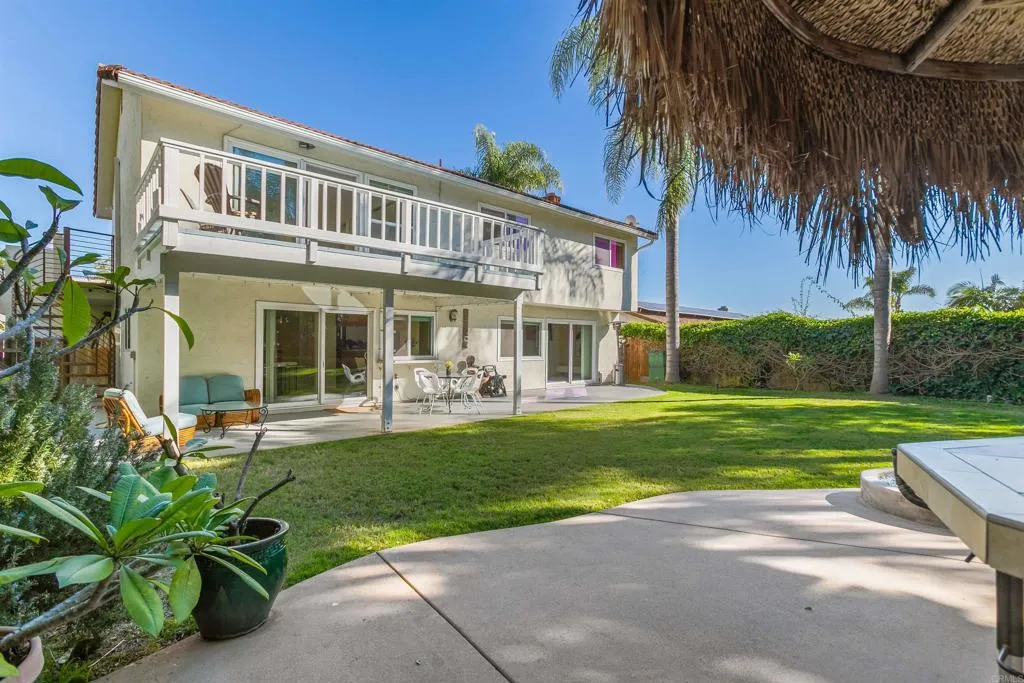 2252 Soledad Rancho Road San Diego, CA 92109 - Photo 33 of 39 a front view of a house with a garden and porch