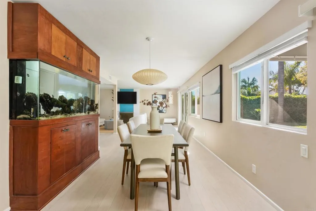 2252 Soledad Rancho Road San Diego, CA 92109 - Photo 4 of 39 a dining room with furniture window and wooden floor