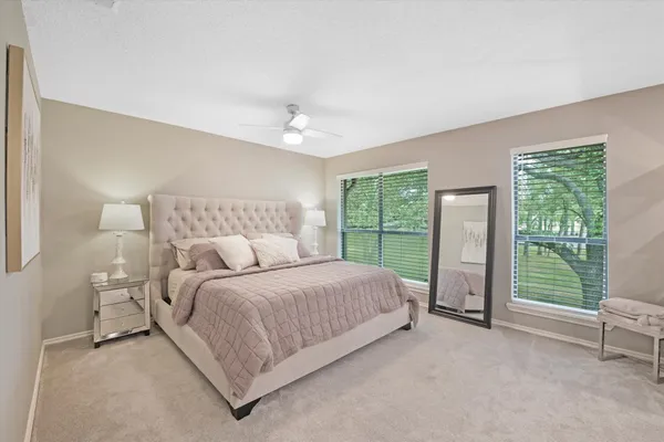 a bed room with a bed and a view