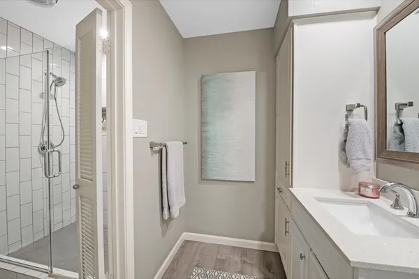 a bathroom with a sink and shower