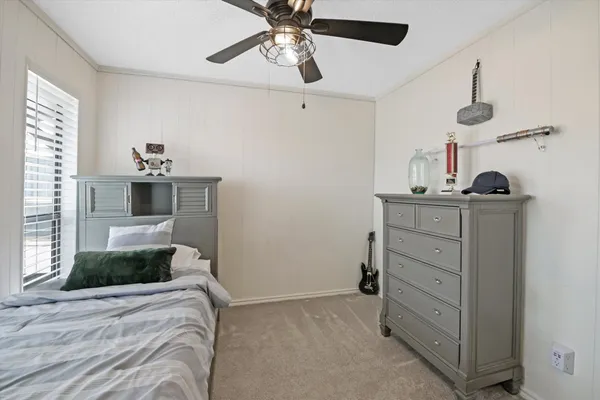 a bedroom with a bed and cabinets