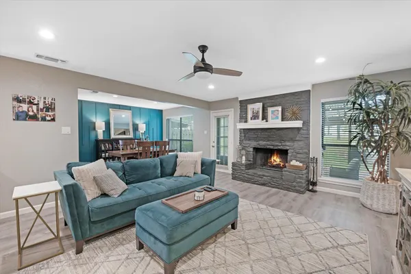 a living room with furniture and a fireplace