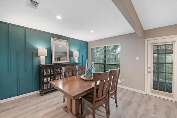 a view of a dining room with furniture window and outside view