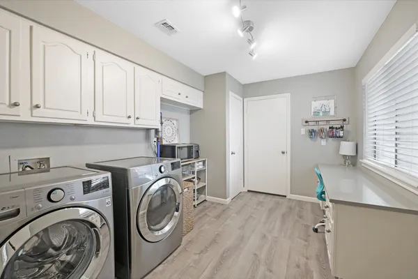 a view of livingroom with washer and dryer