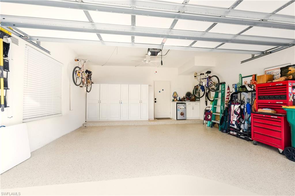 6185 Reserve Circle, Unit 1403 Naples, FL 34119 - Photo 30 of 41 2 car garage with epoxy floor & storage