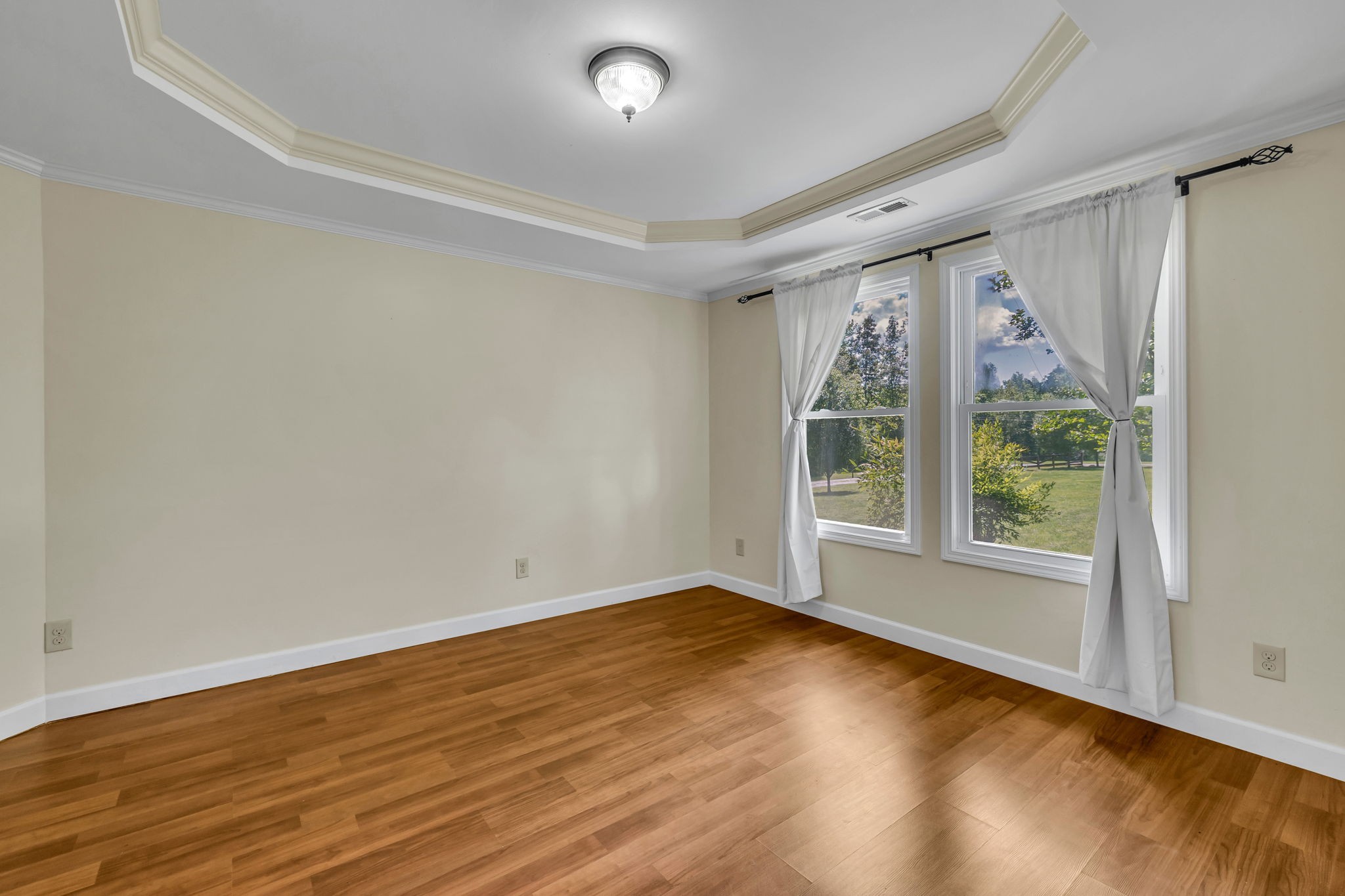 427 Telegraph Street Tennessee Ridge, TN 37178 - Photo 23 of 47 a view of an empty room with wooden floor and a window