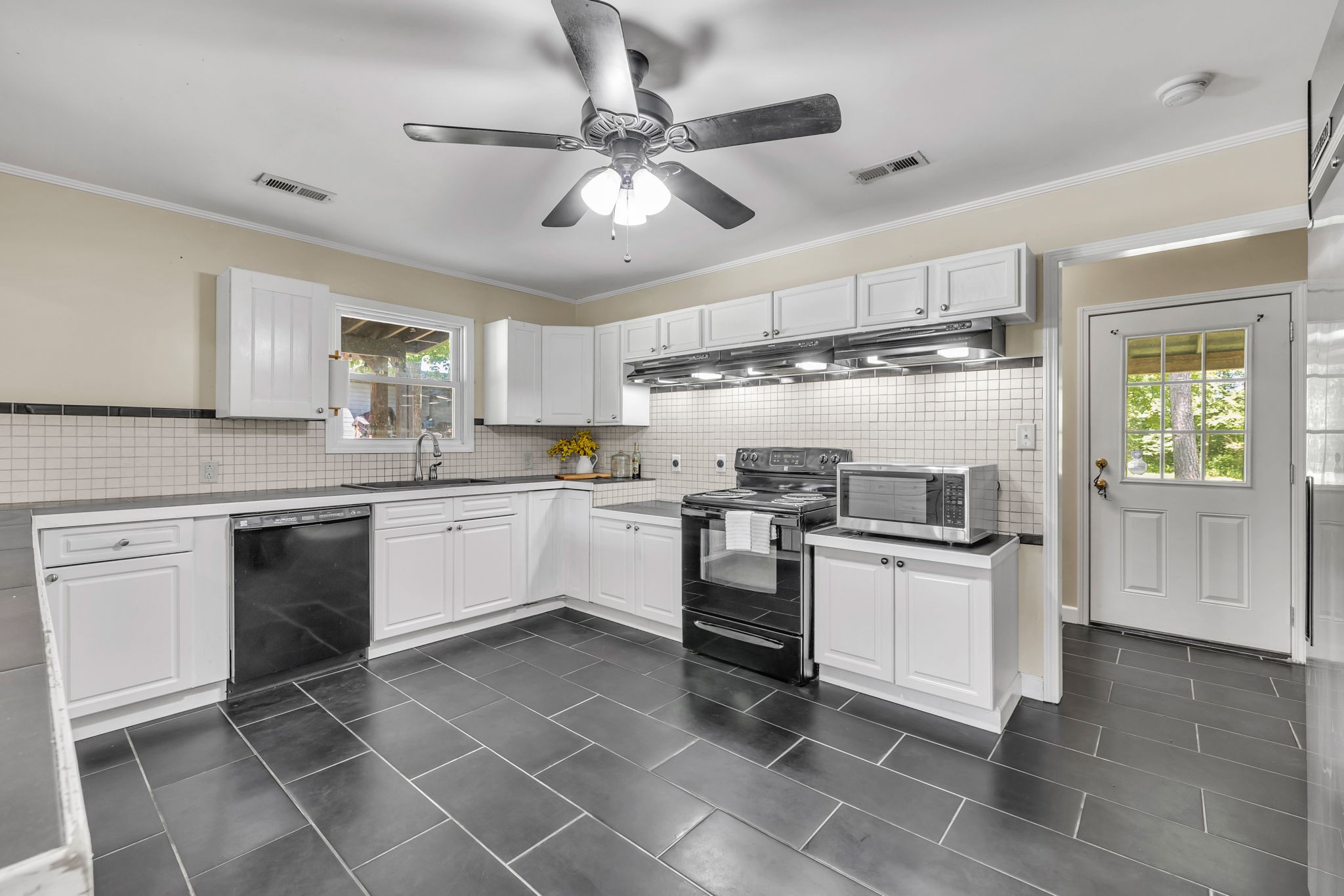 427 Telegraph Street Tennessee Ridge, TN 37178 - Photo 8 of 47 a kitchen with stove cabinets and window