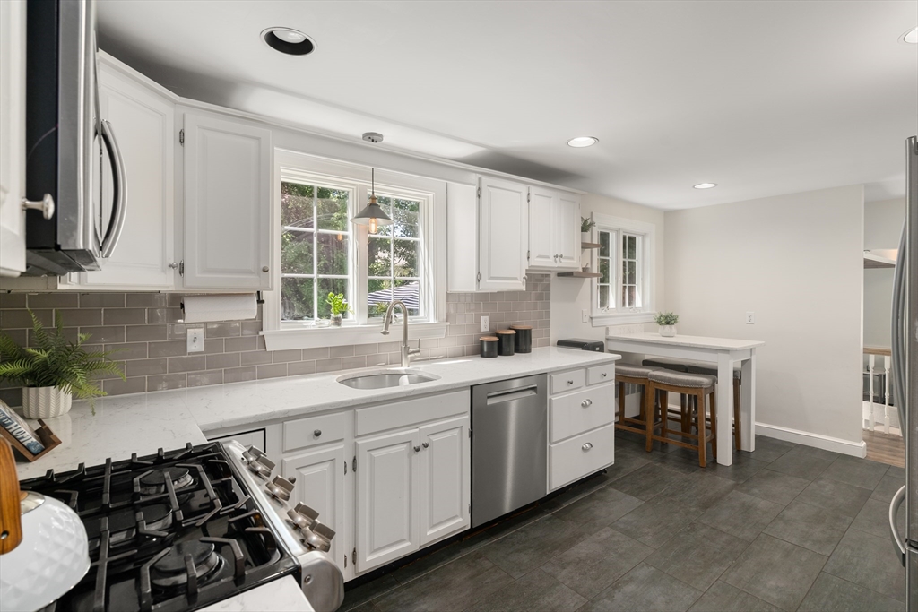 40 Hooper Street Westwood, MA 02090 - Photo 11 of 39 a kitchen with a sink stove and cabinets