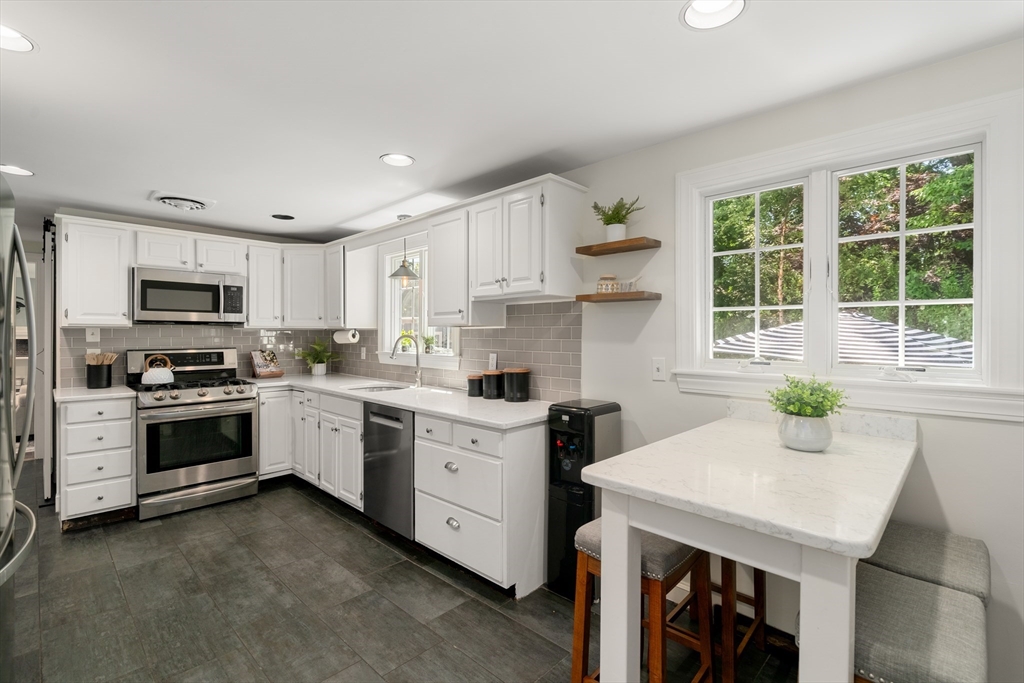 40 Hooper Street Westwood, MA 02090 - Photo 12 of 39 a kitchen with a sink stove and microwave