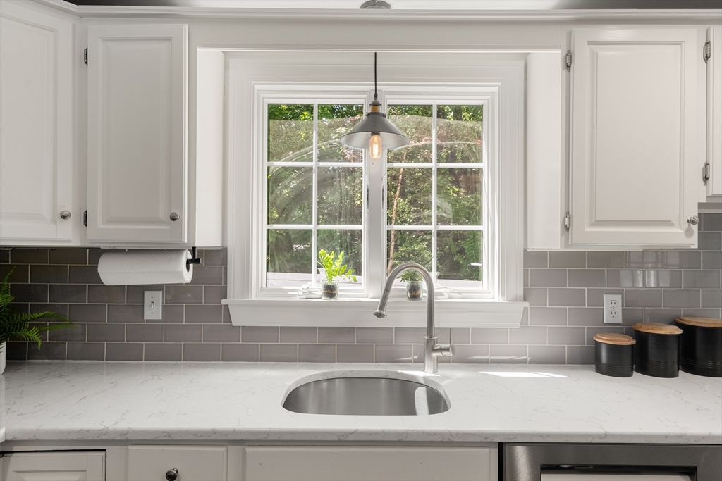 40 Hooper Street Westwood, MA 02090 - Photo 14 of 39 a kitchen with a sink and cabinets